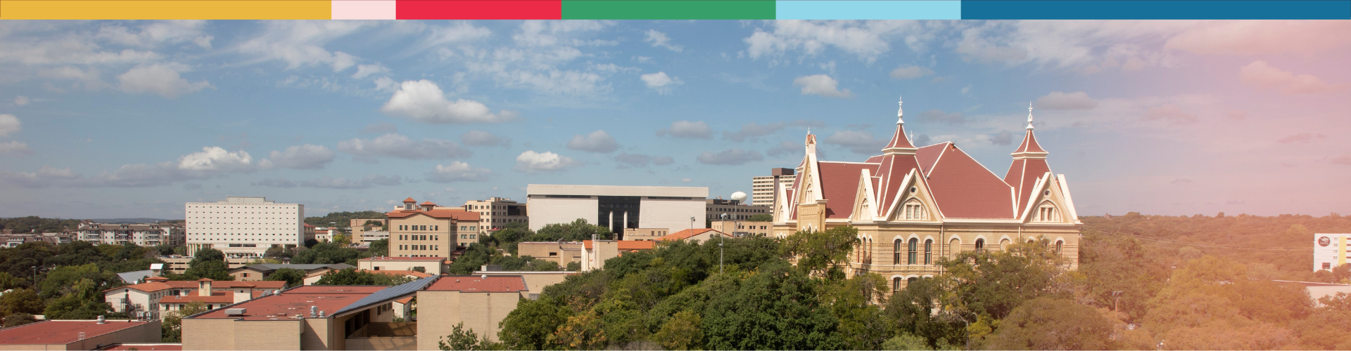 A skyline of Texas State university on a sunny day.