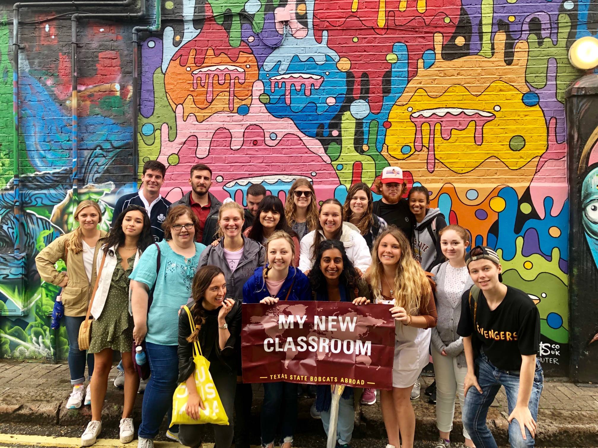 Students holding banner saying My New Classroom