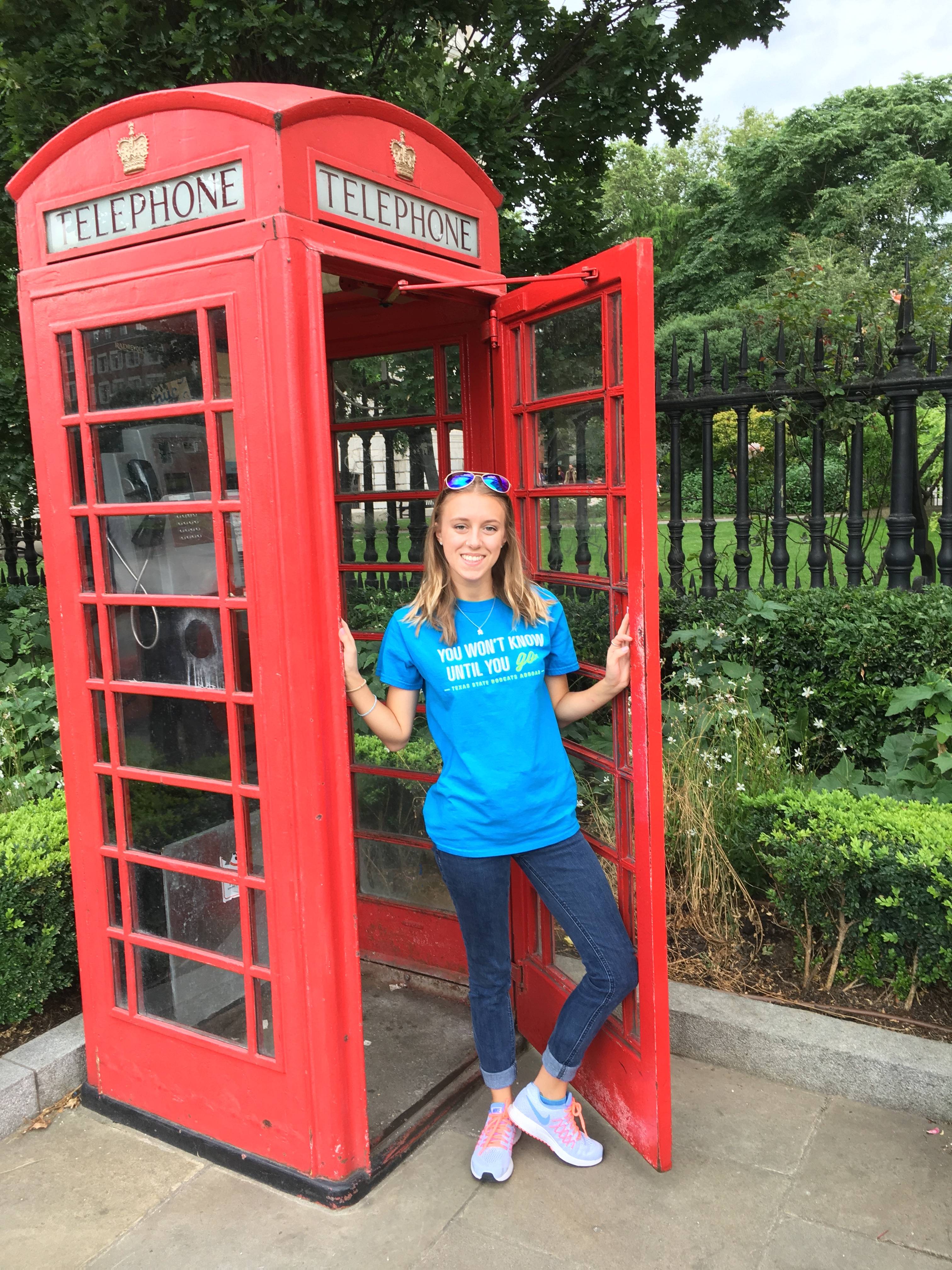 Student by phone booth