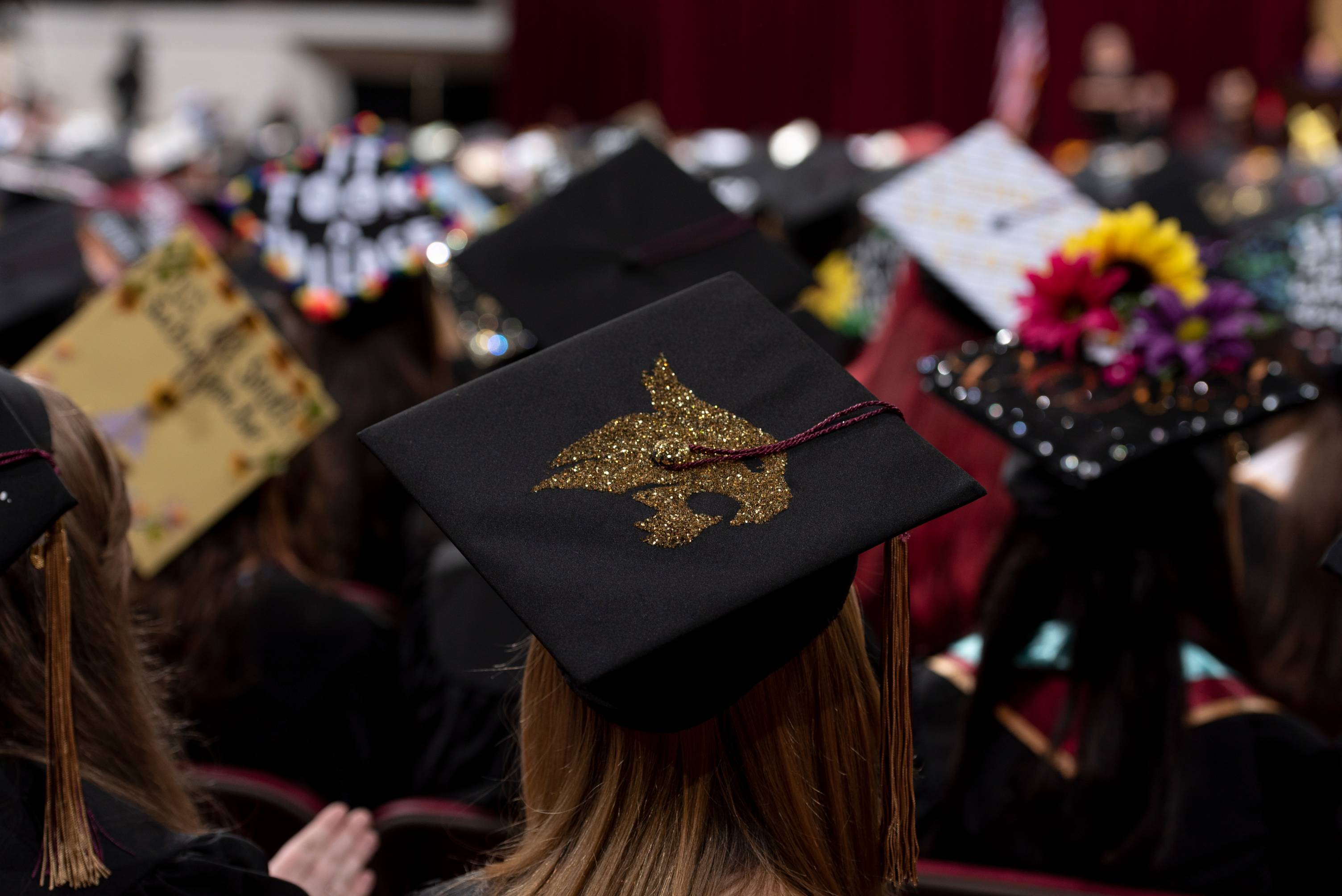 Students at a Texas State University commencement ceremony.