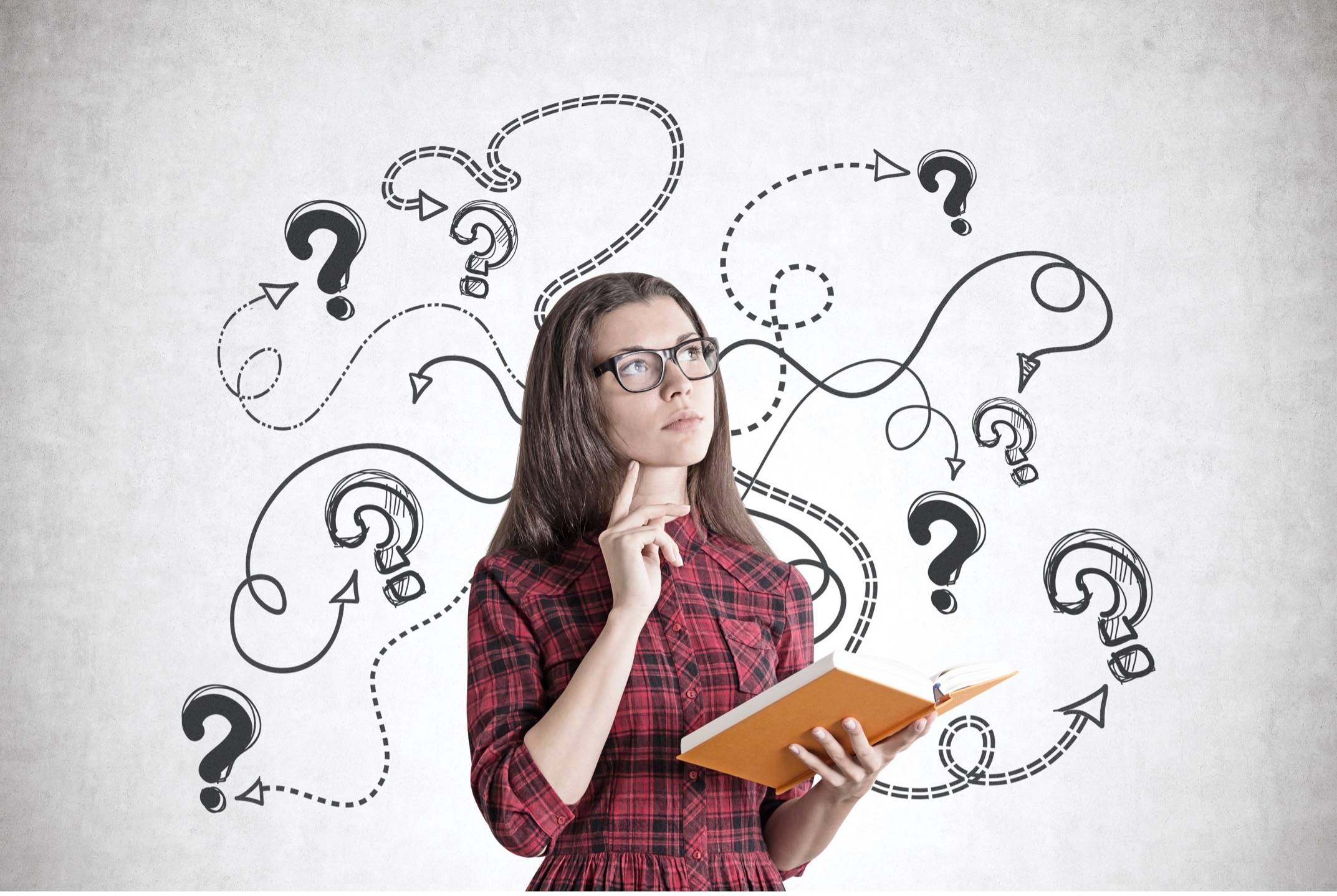 Person thinking with questions marks surrounding her