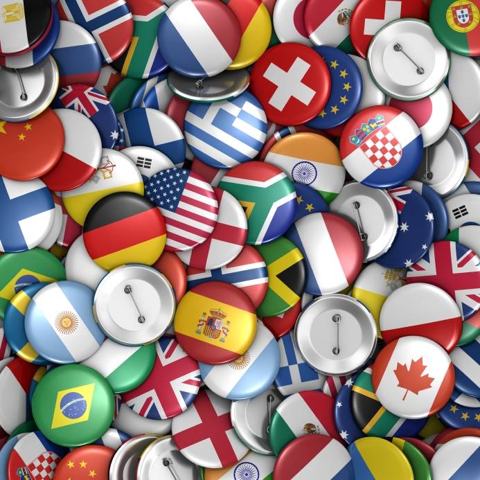 Assorted buttons with national flags on them