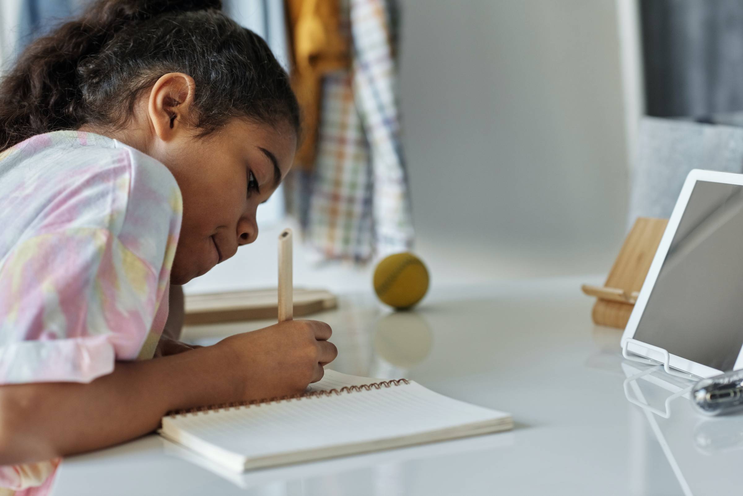 a young kid participating in a writing camp