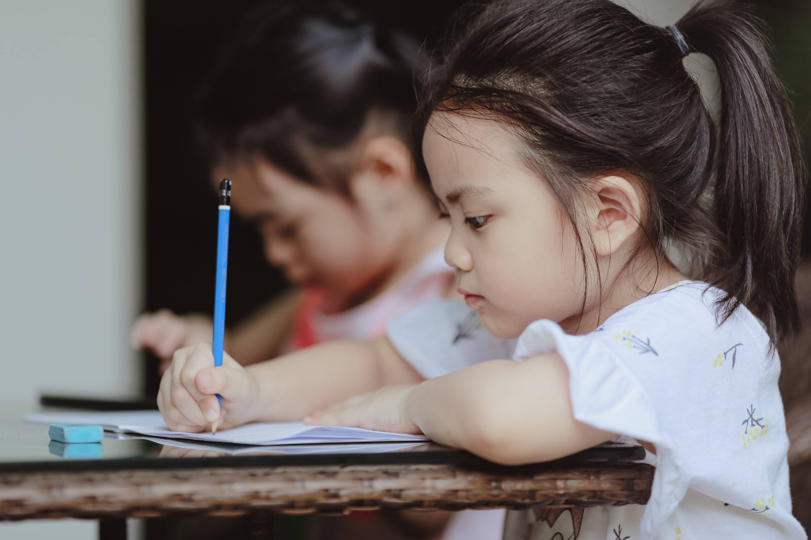 a young kid participating in a writing camp