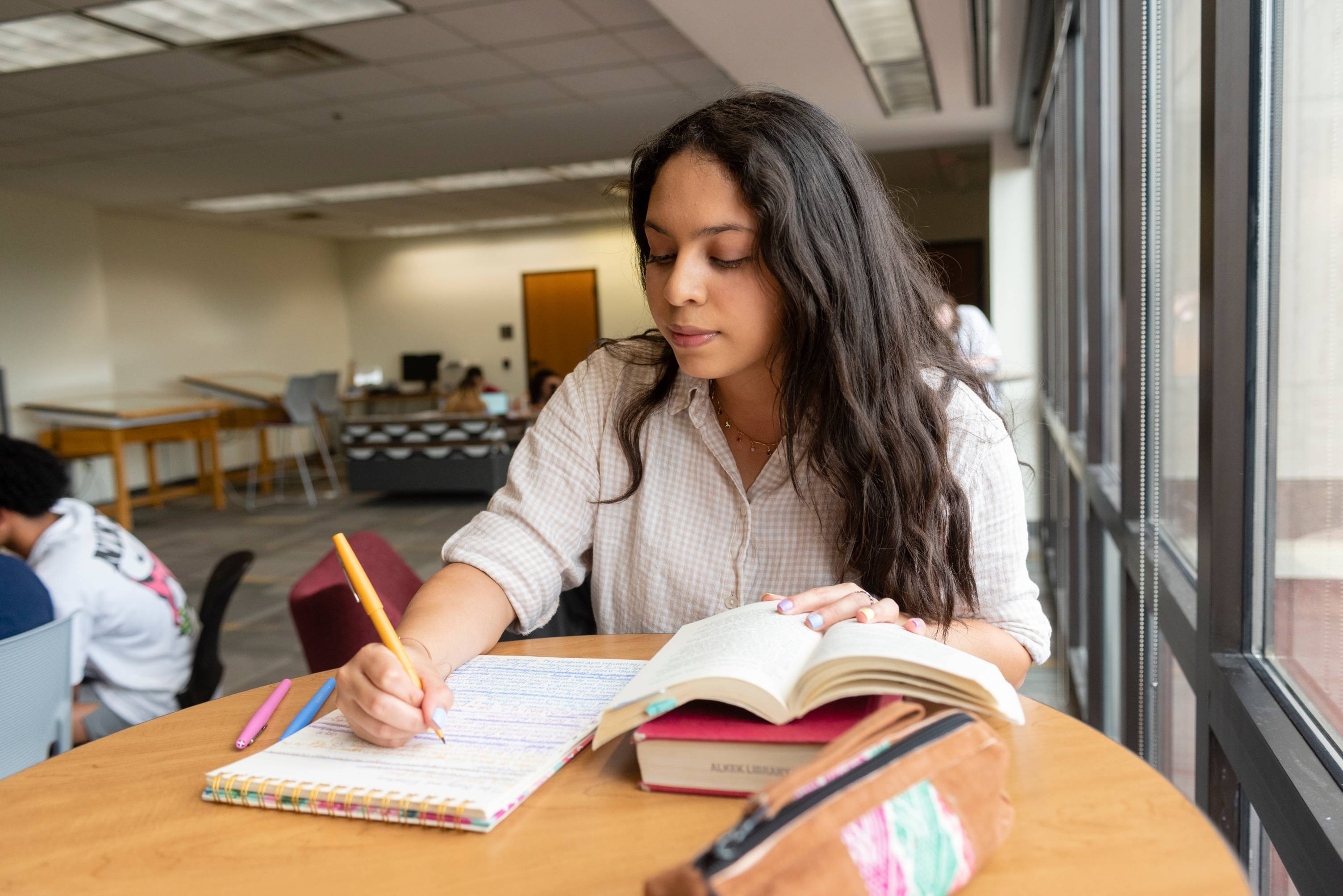 Student sitting at a table studying