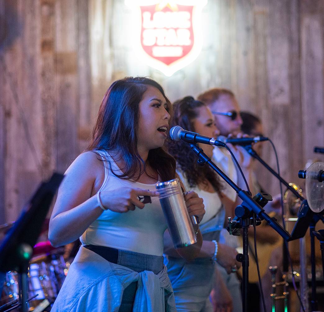 woman singing into microphone