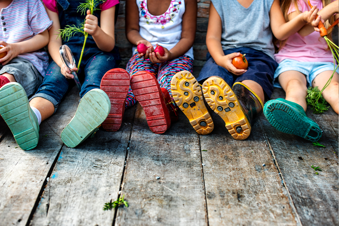 Children sitting on a wooden floor