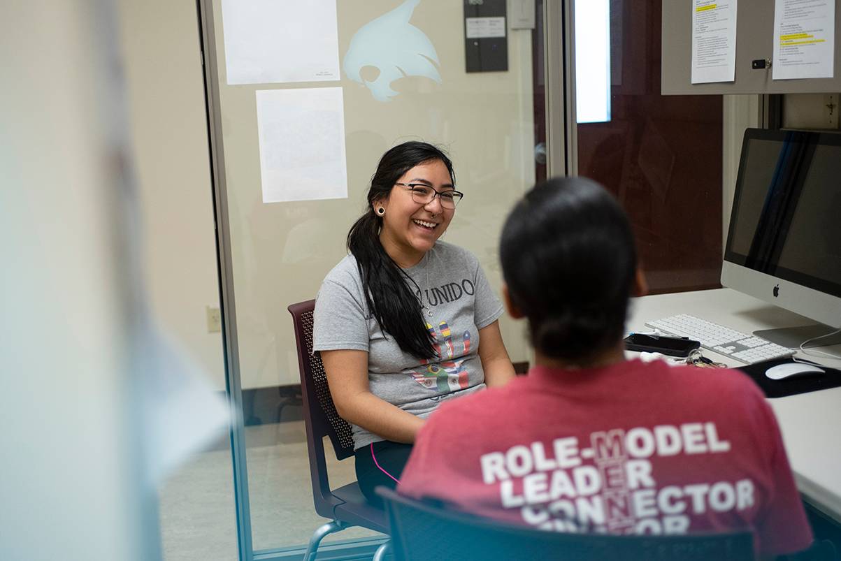 female student speaking to a mentor