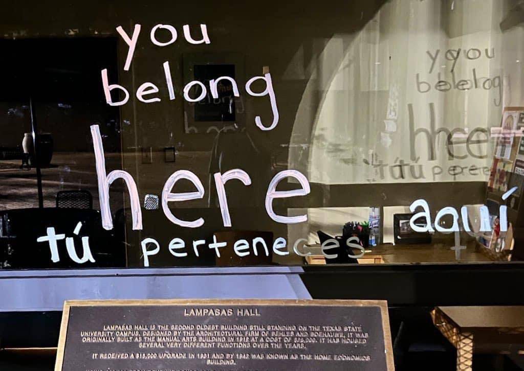 sign written on window reading 'you belong here'