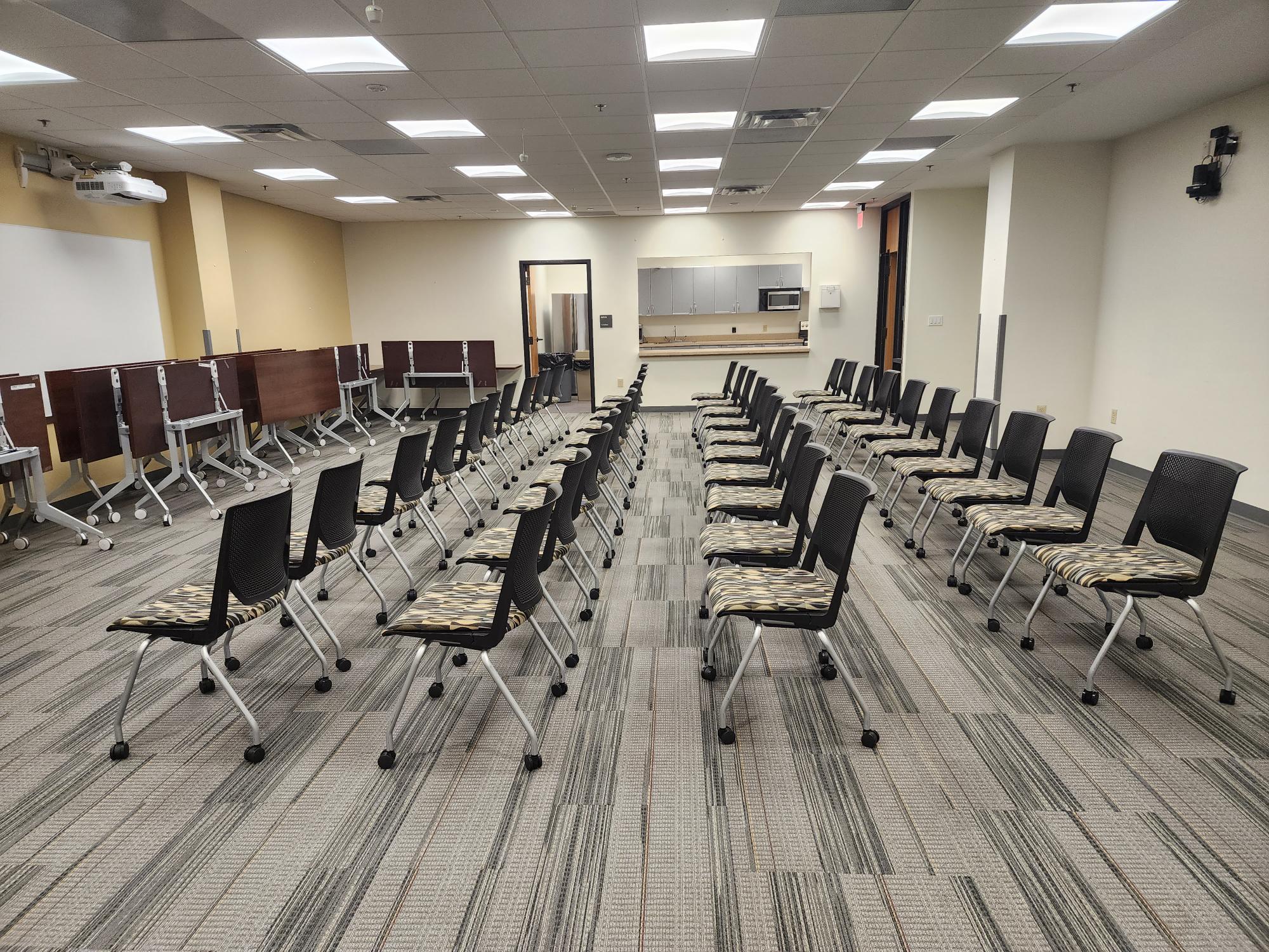 Conference halls with chairs in rows.