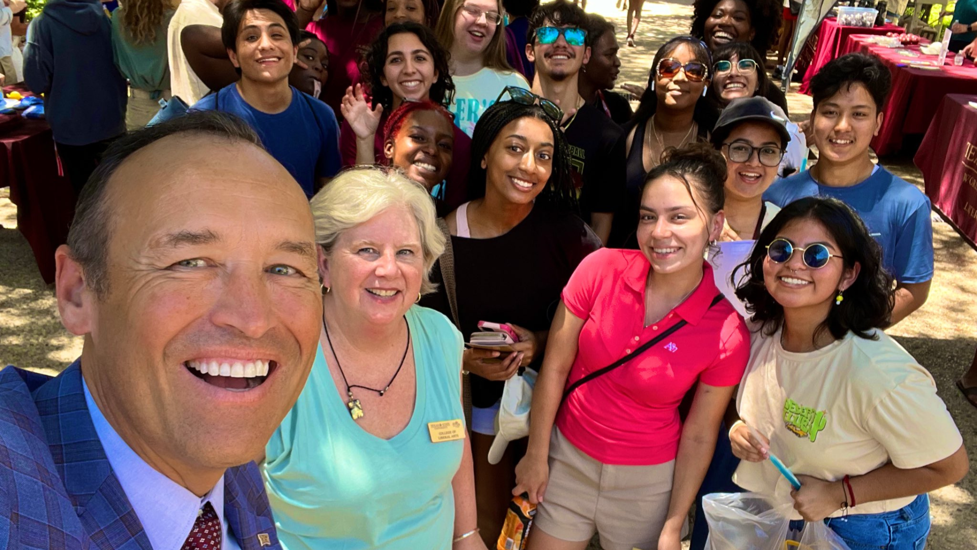 President Damphousse takes a selfie with a group of Bobcat community members and students. 