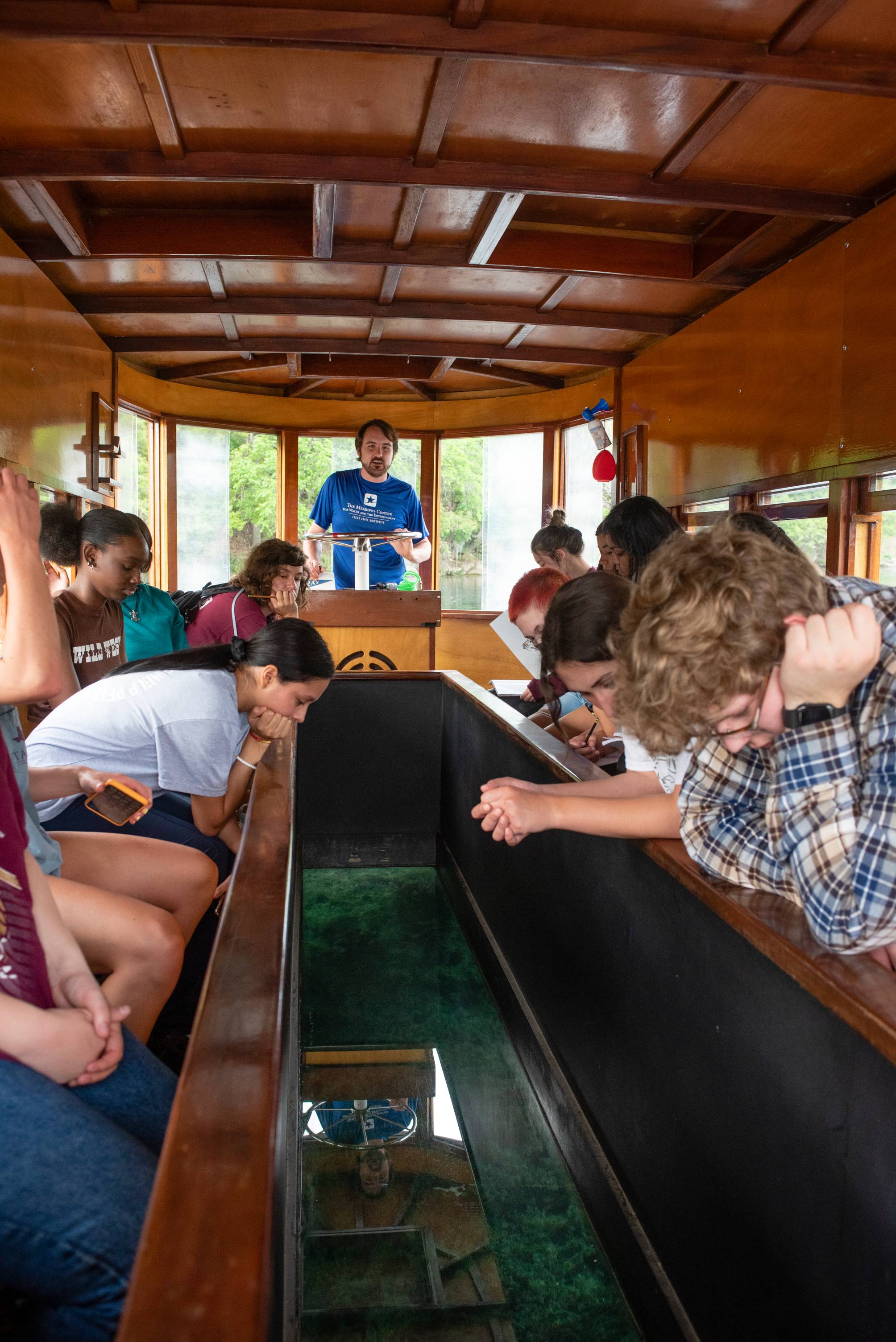Meadows Center visitors on a glass-bottom boat