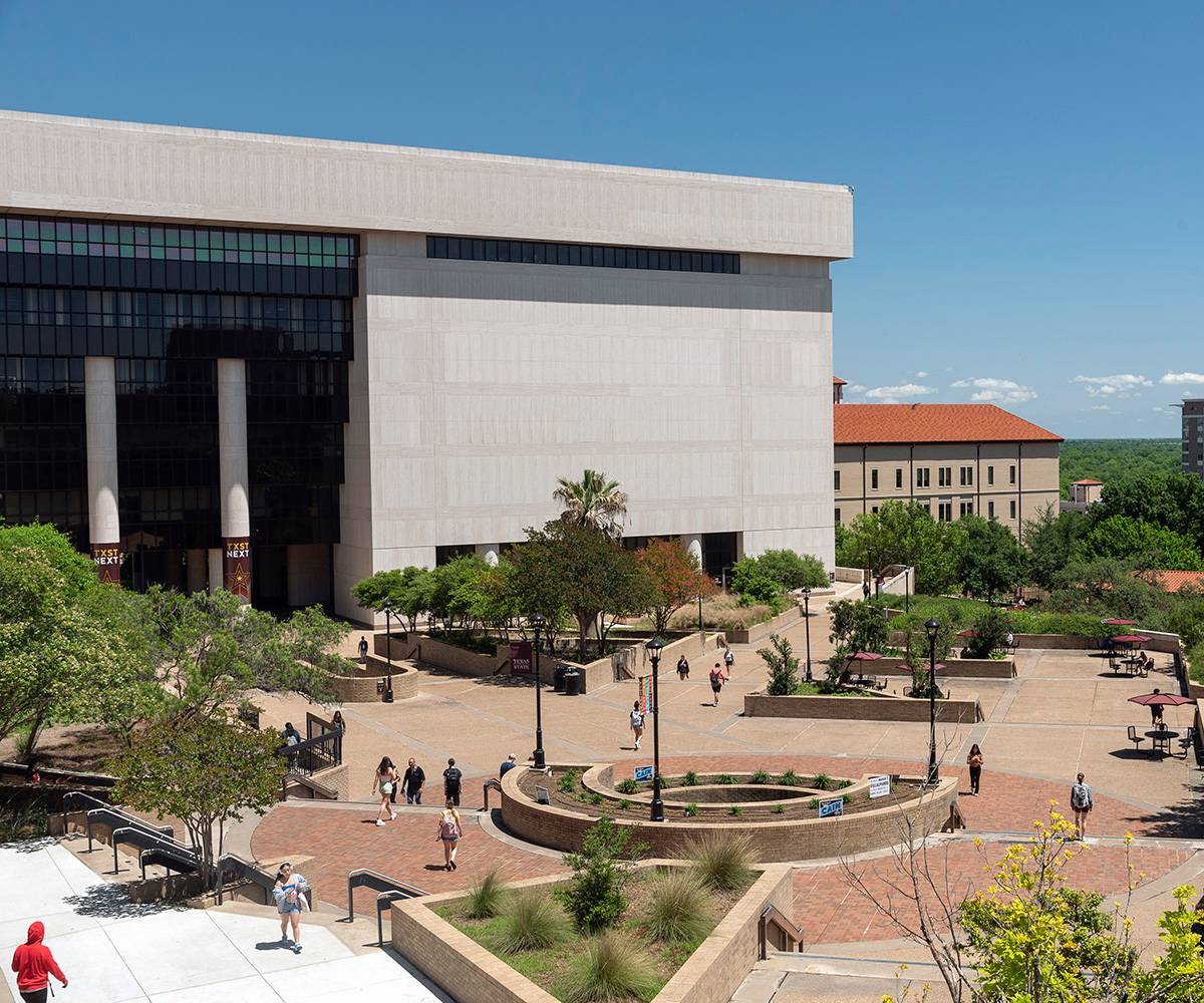 view of mall area with students outside Alkek library