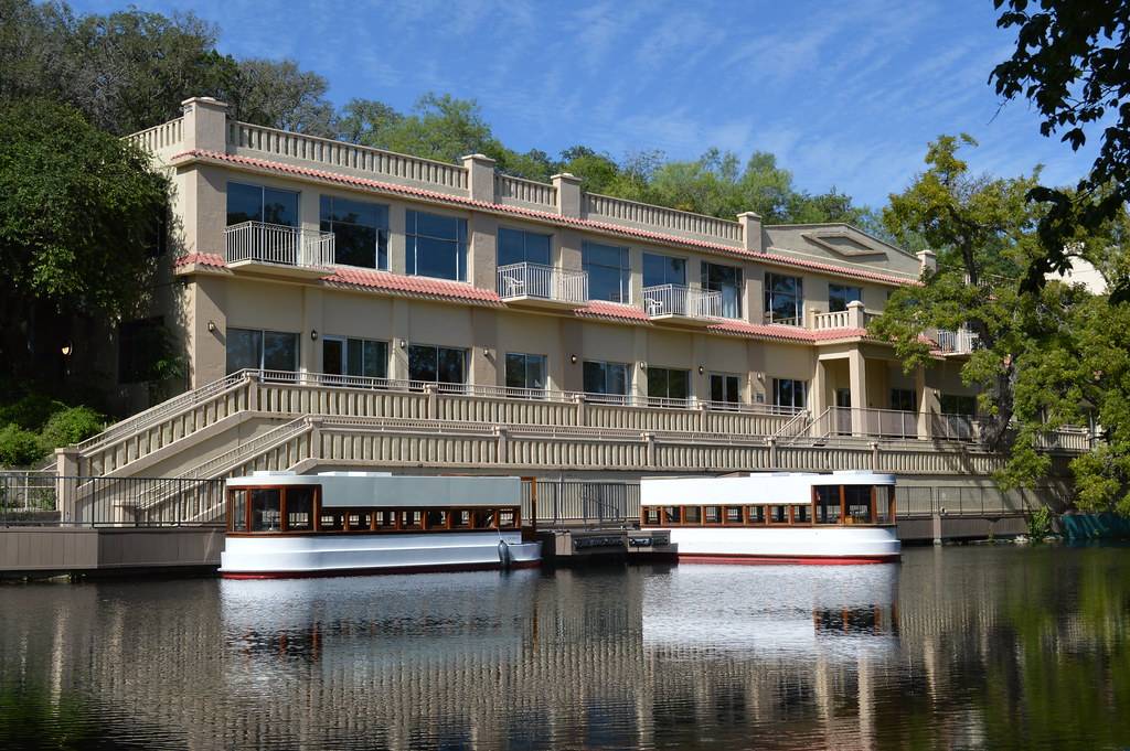 meadows center in the background with boats in the water in the foreground 