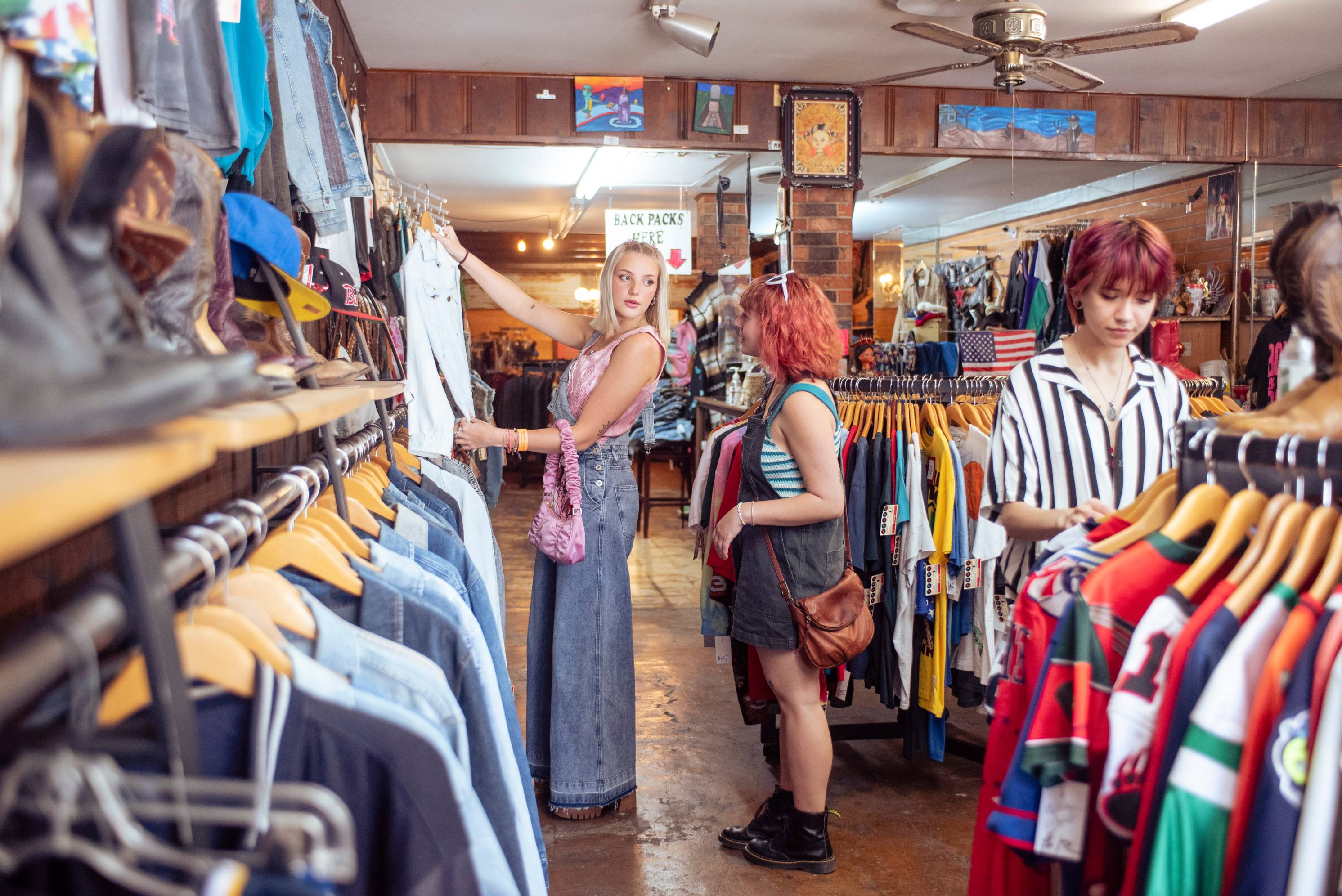 people shopping in a thrift store