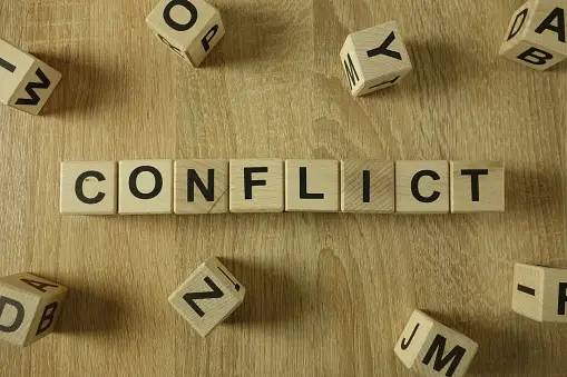 Scabble pieces spelling conflict