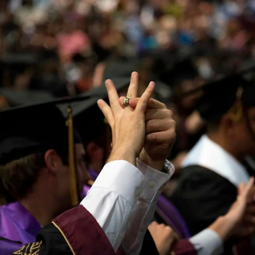 TXST student holding hand up with Official Ring featured 