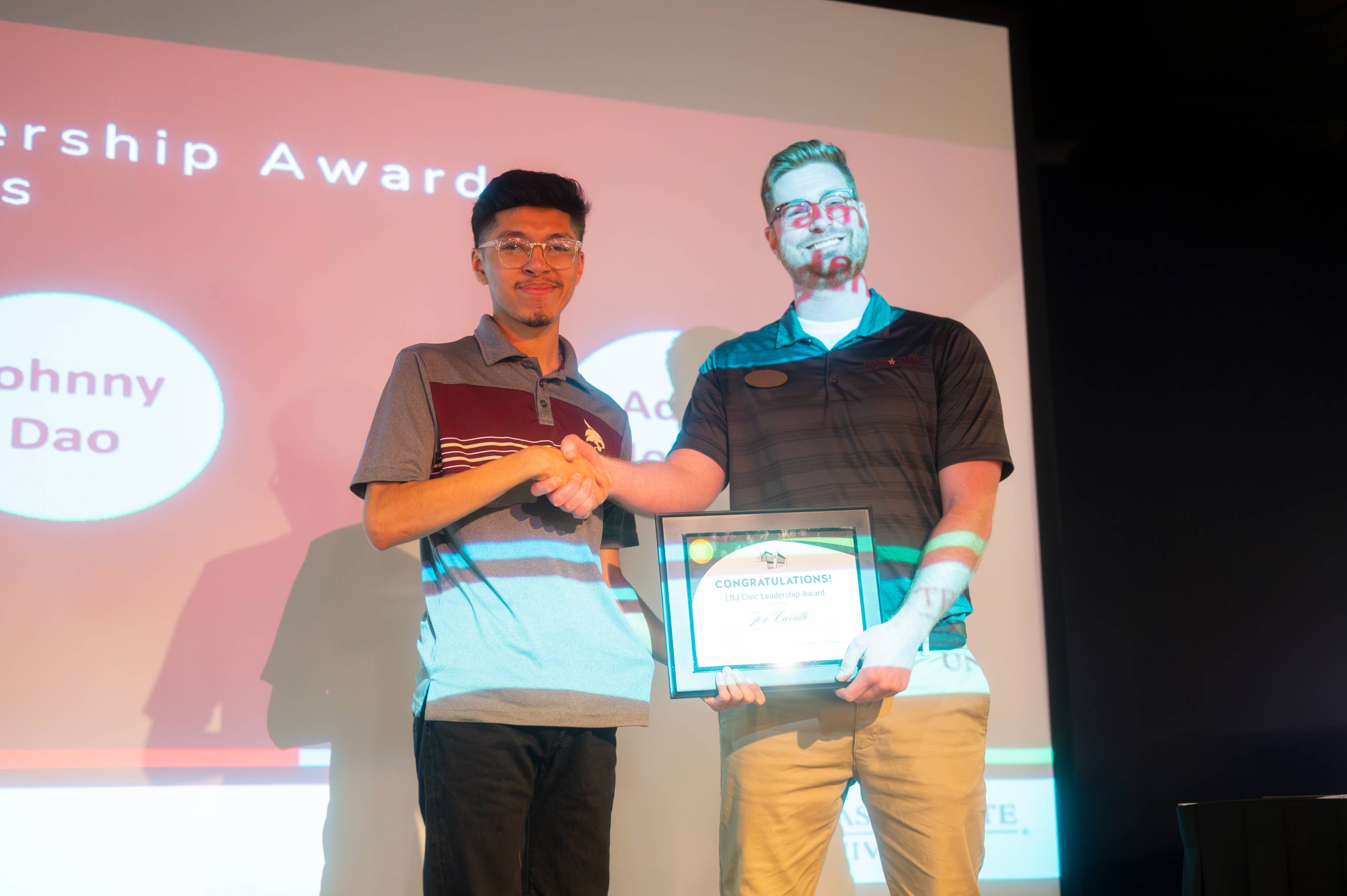 Jose Carillo receiving and posing with Civic Leadership Award for 2023