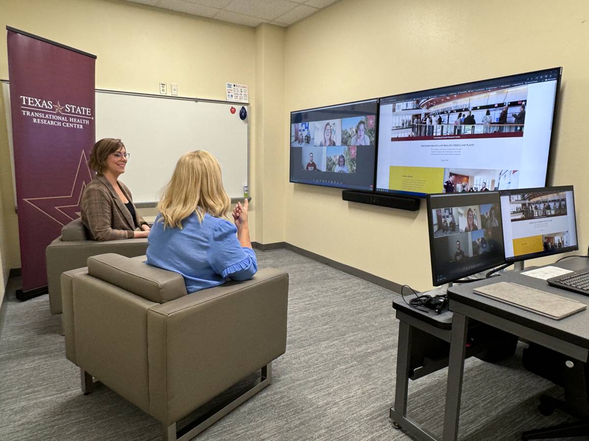 Two presenters give a live presentation virtually while participants watch from their work computers.