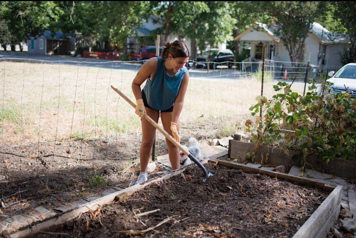 Madelyn Parsons tends to the community garden.