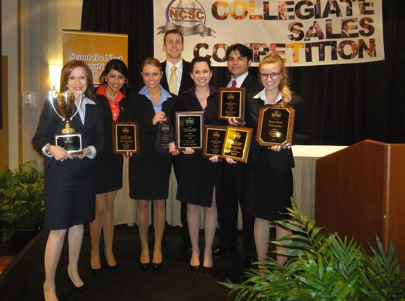 Group of students holding awards