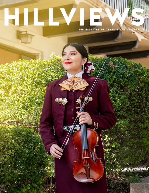 female mariachi performer posing with string instrument