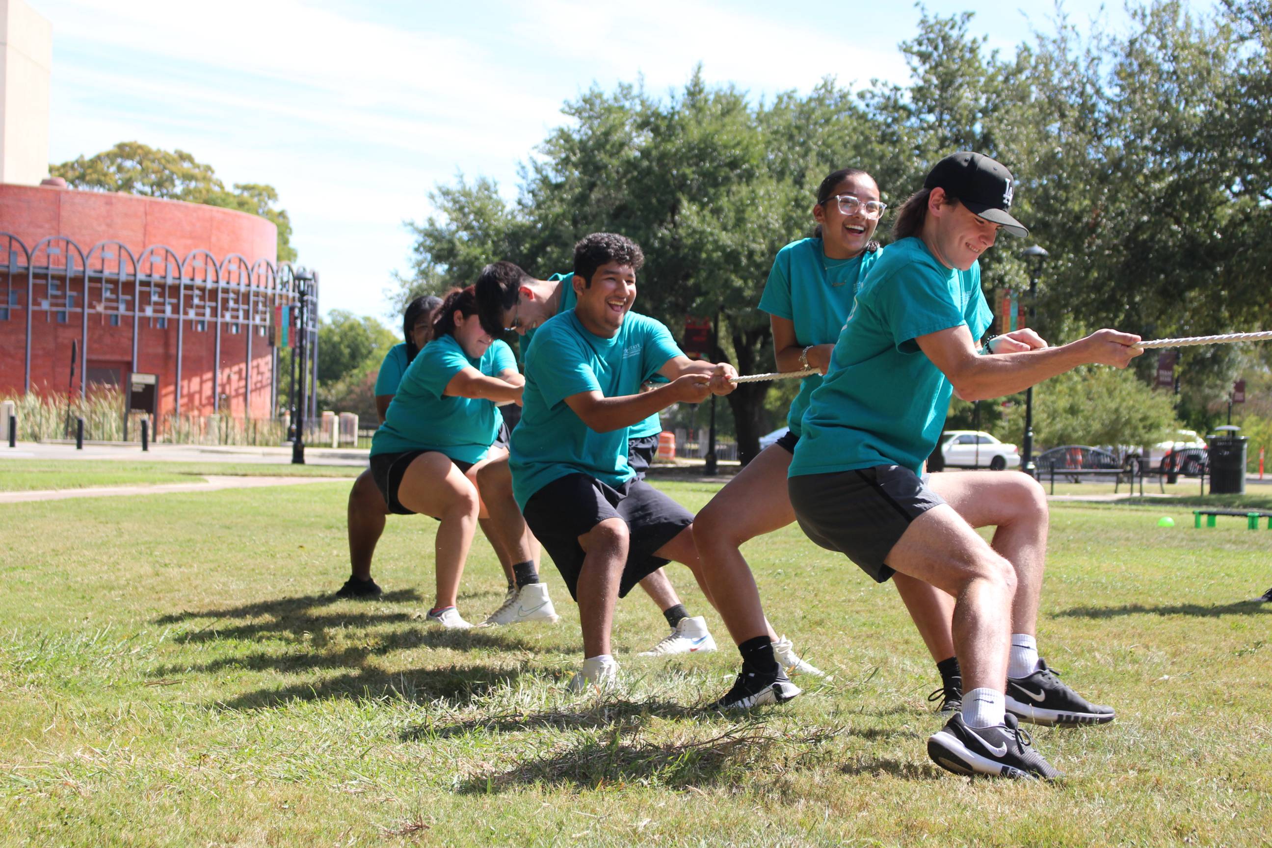 students playing tug of war on the concho green
