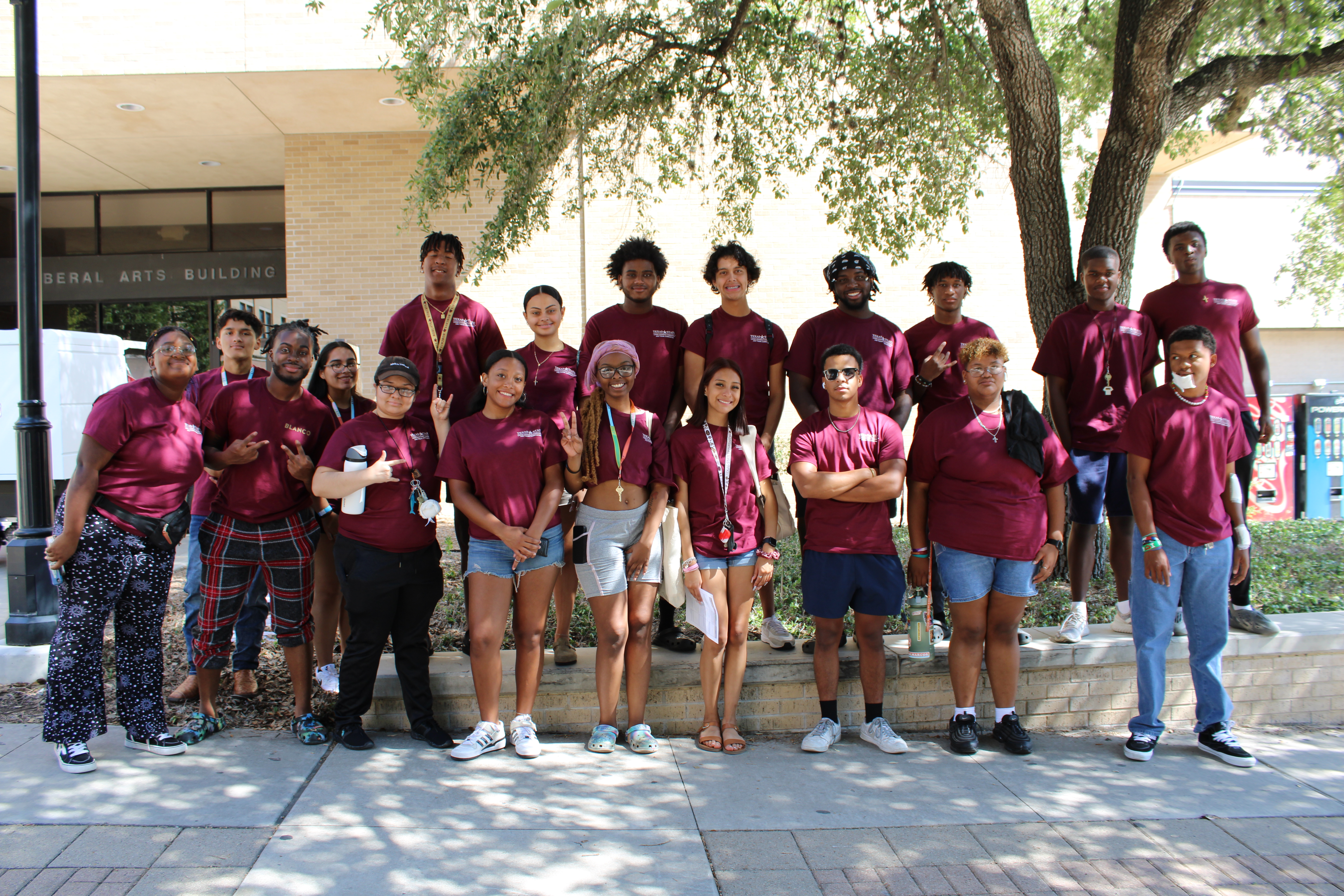 Group of people in matching maroon shirts