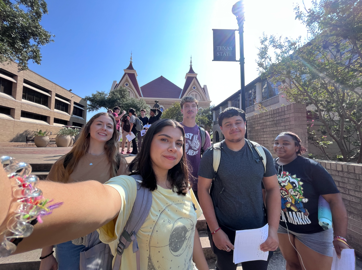 Students taking a selfie at old main