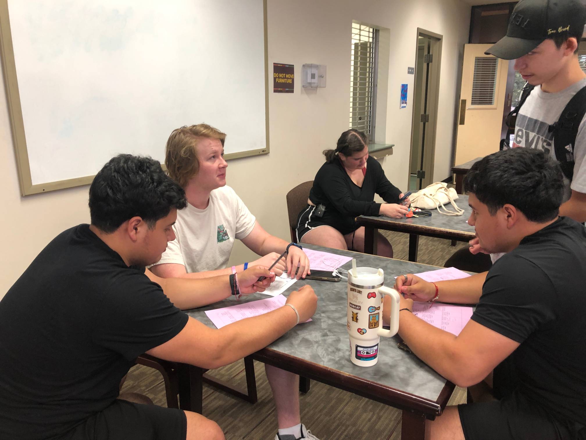boys talking at a table