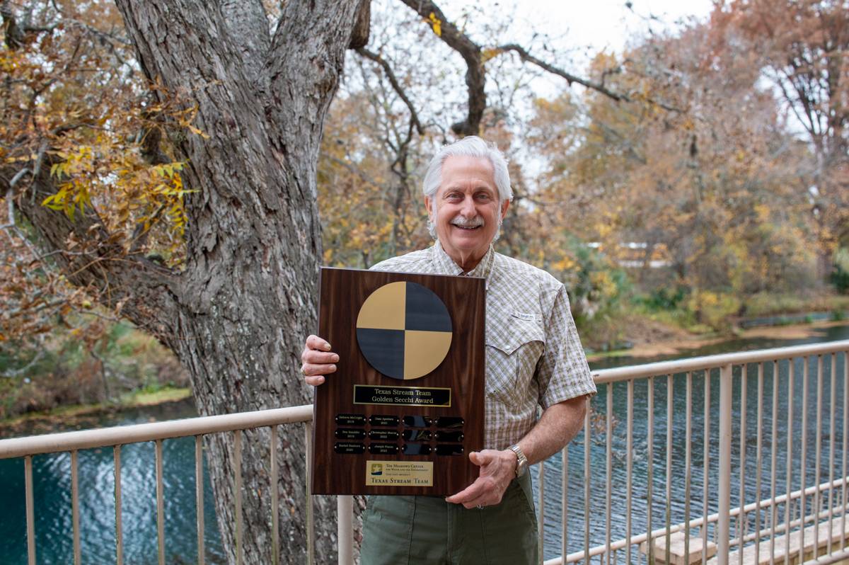 Joe Piazza poses with the golden secchi award plaque.