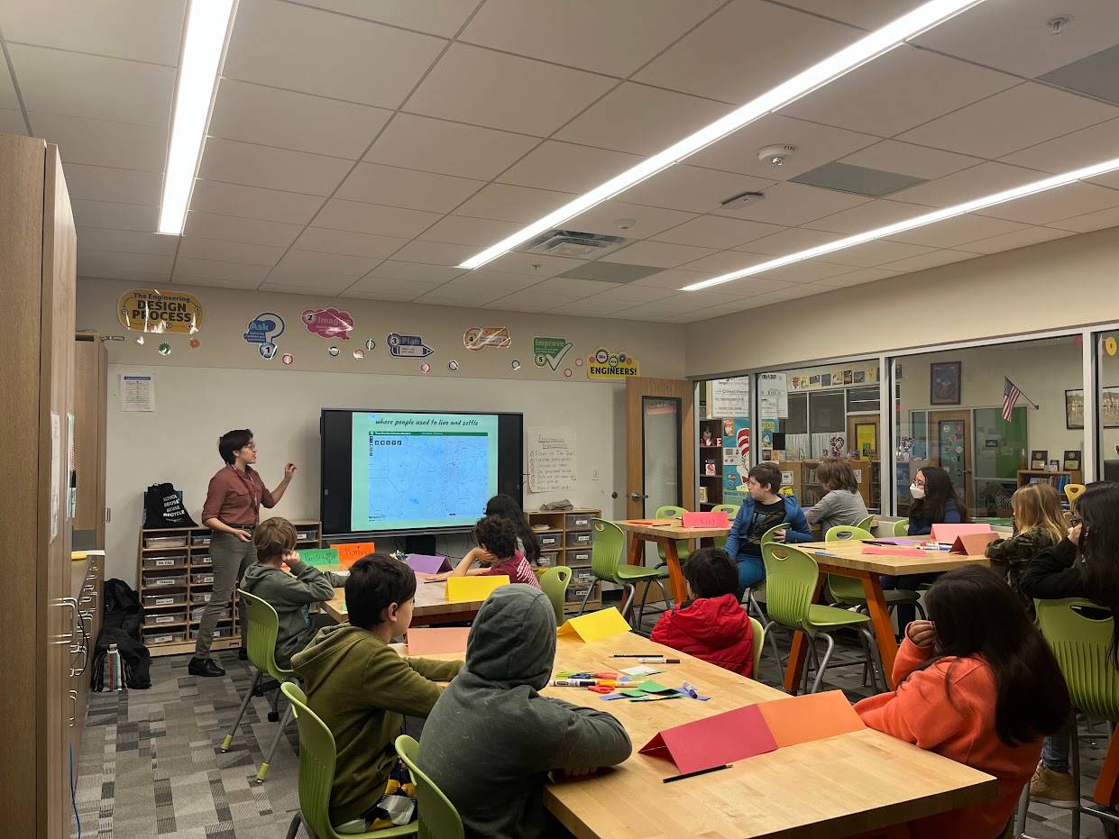 Students in Crockett Elementary's makerspace room are focused on a presentation being delivered by Office of Sustainability Intern Adriana Montoya. 