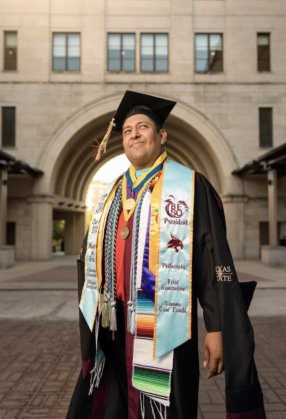 Graduate Marcelino Saucedo in Cap and Gown