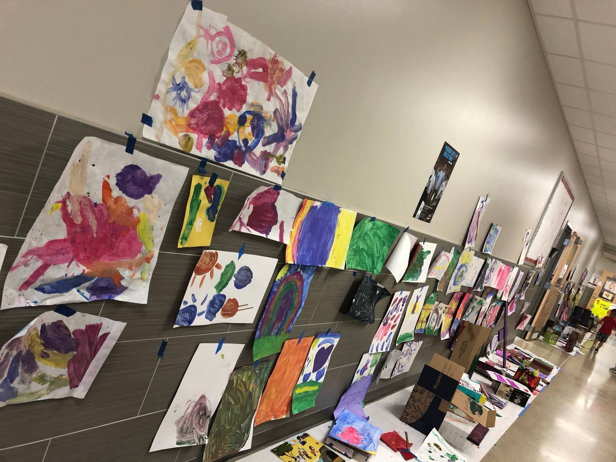 student paint artwork in elementary school hallway