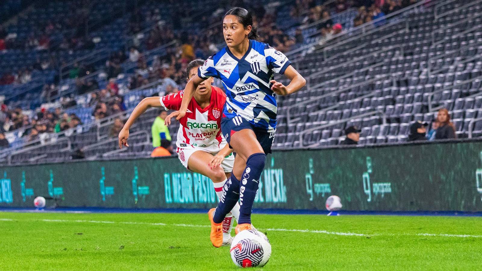 Soccer player Juana Plata kicking ball during pro game