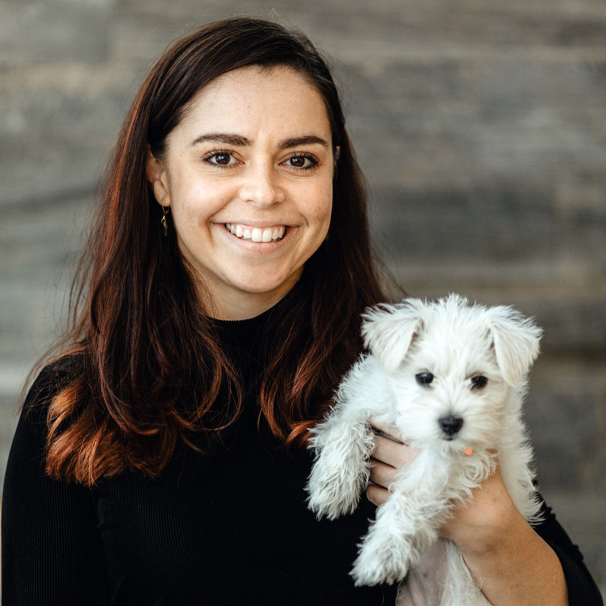 Elisa Sepulveda with a white dog