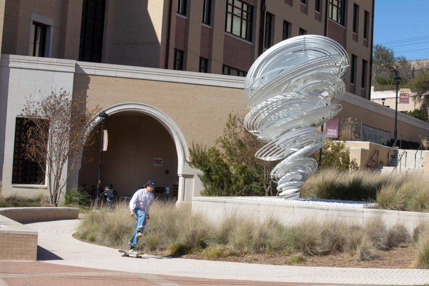 The "Texas Twister" sculpture outside Bruce and Gloria Ingram Hall is part of the TSUS public art program.