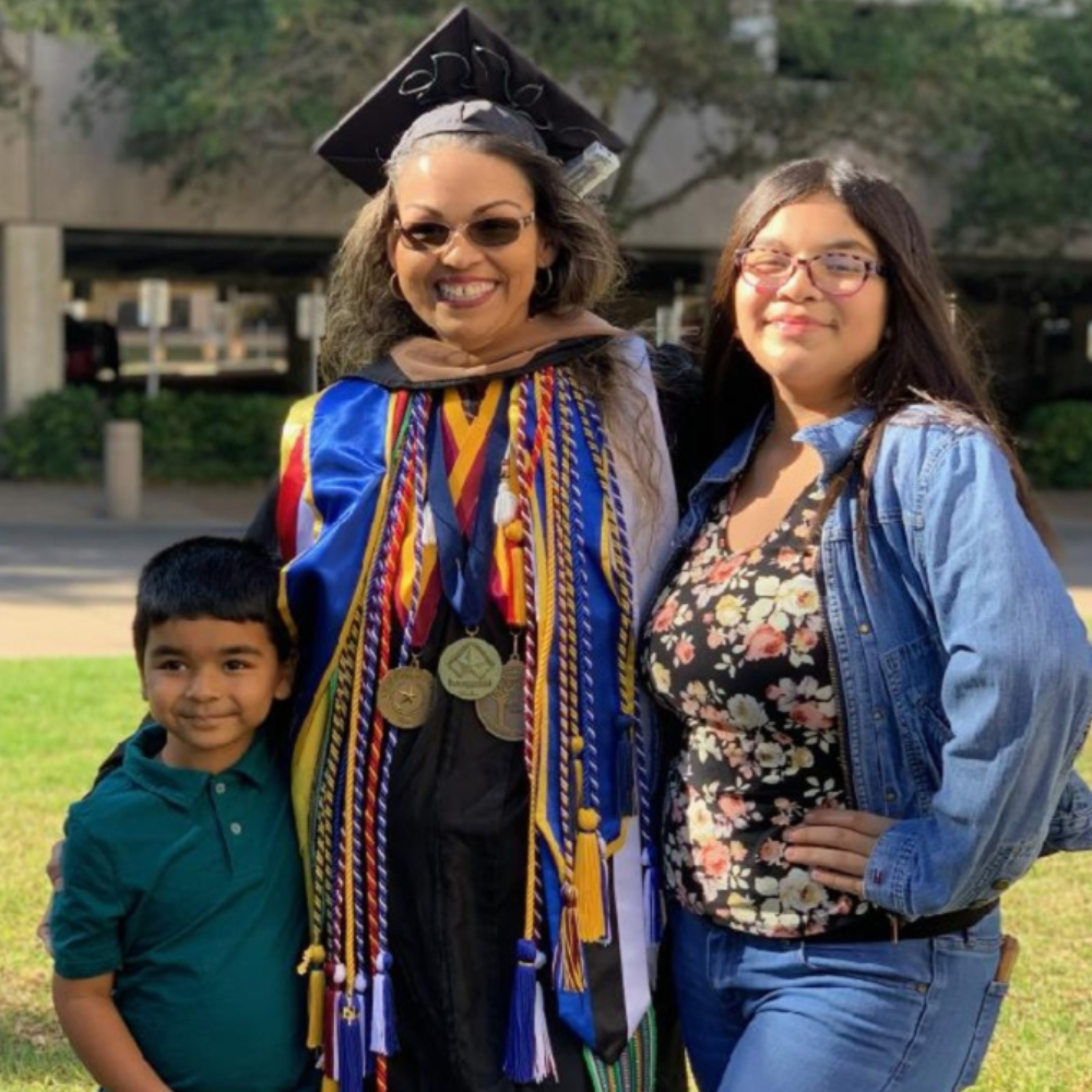 Jessica Ramos-Karmaker with her family after a commencement ceremony