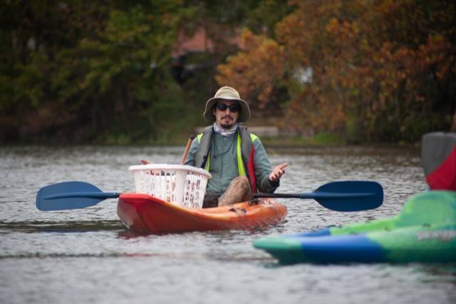 kayak to remove floating invasive plants