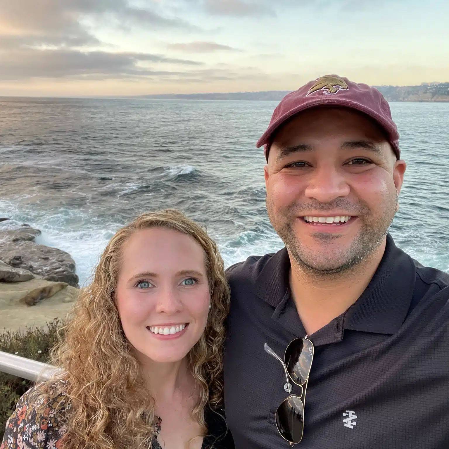 selfie of couple in front of an ocean