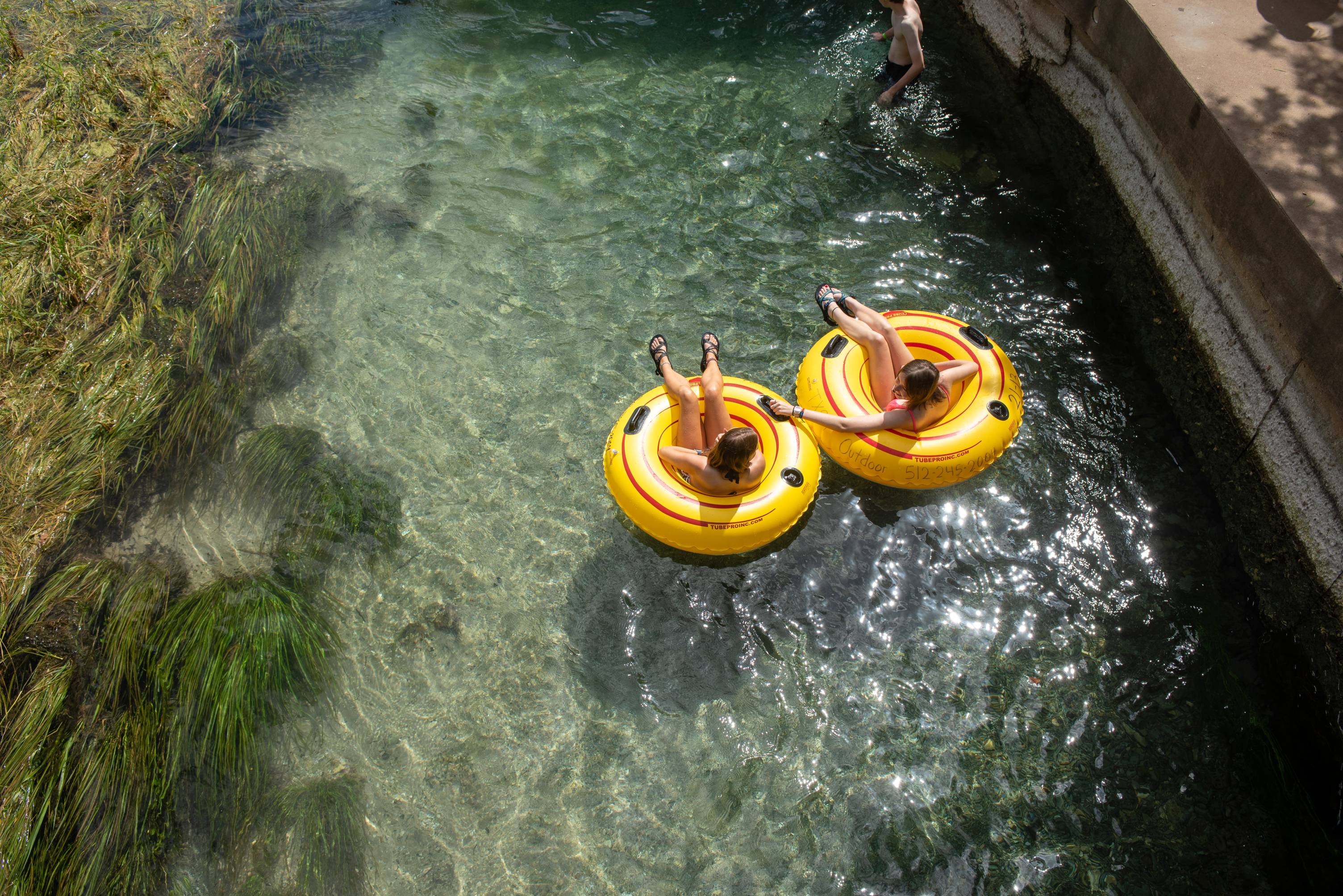 Students tubing down the San Marcos River