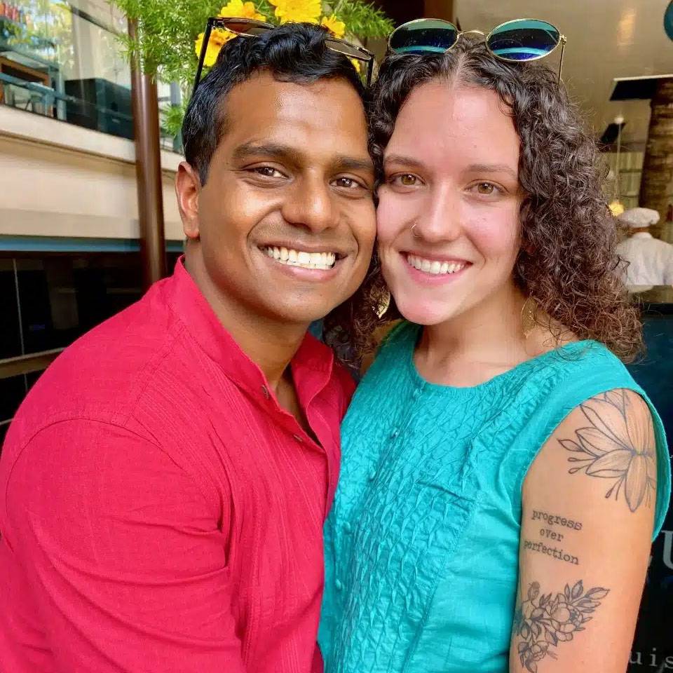 Photo of couple sitting together and smiling