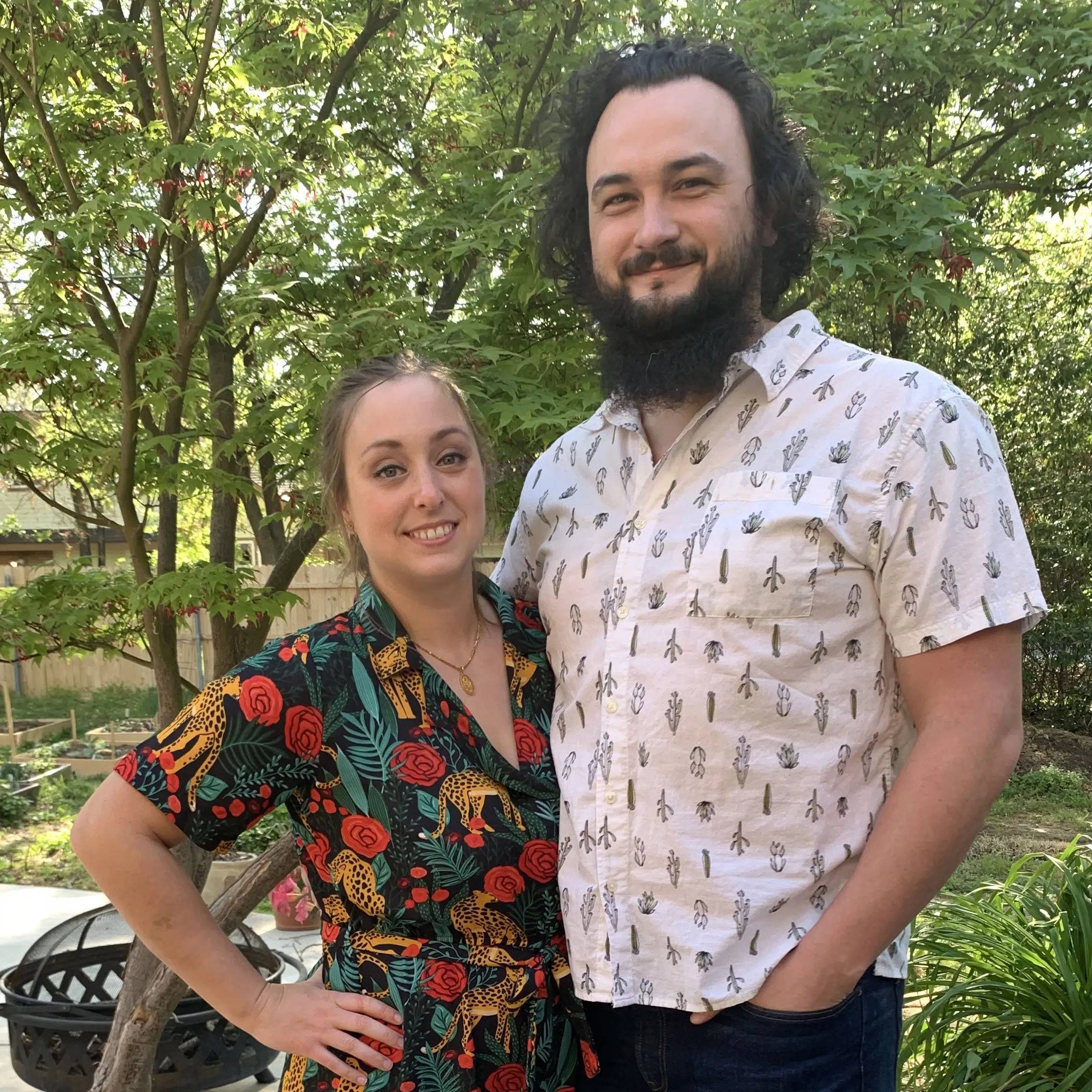 Photo of couple standing together in a forest