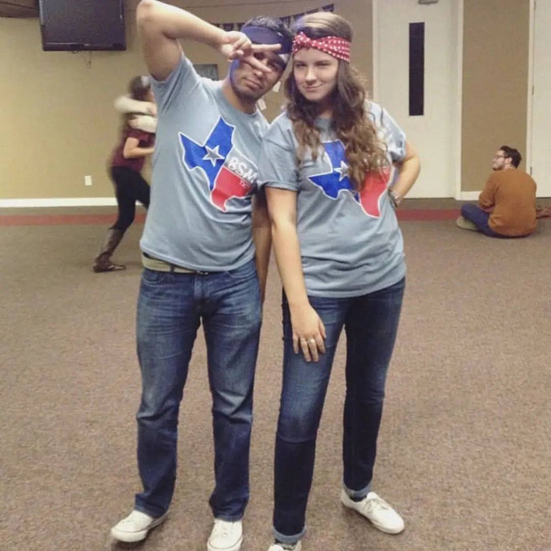 Photo of couple standing together wearing BSM shorts