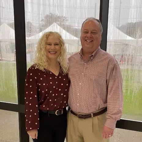 photo of couple standing together smiling