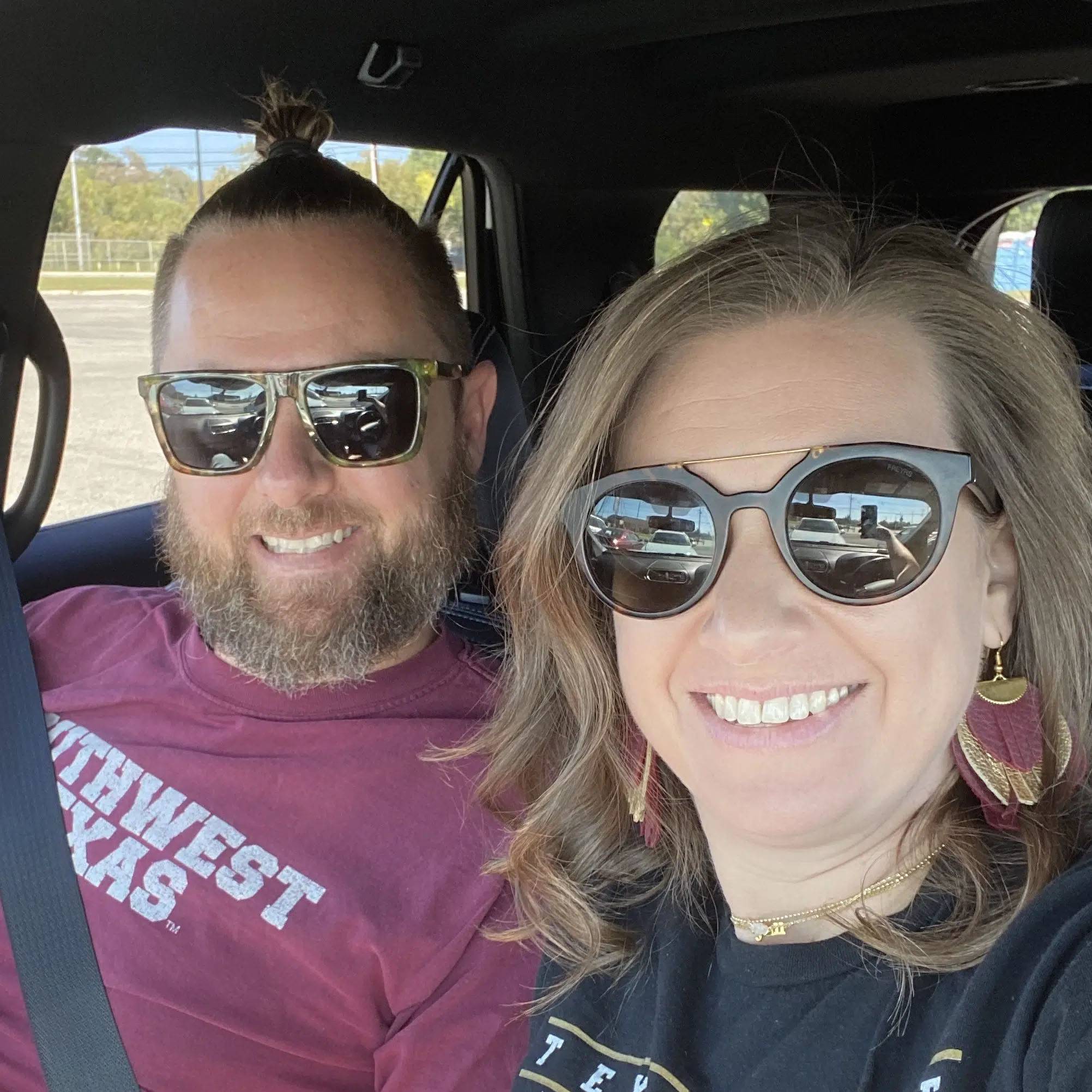 Selfie of couple smiling in a car