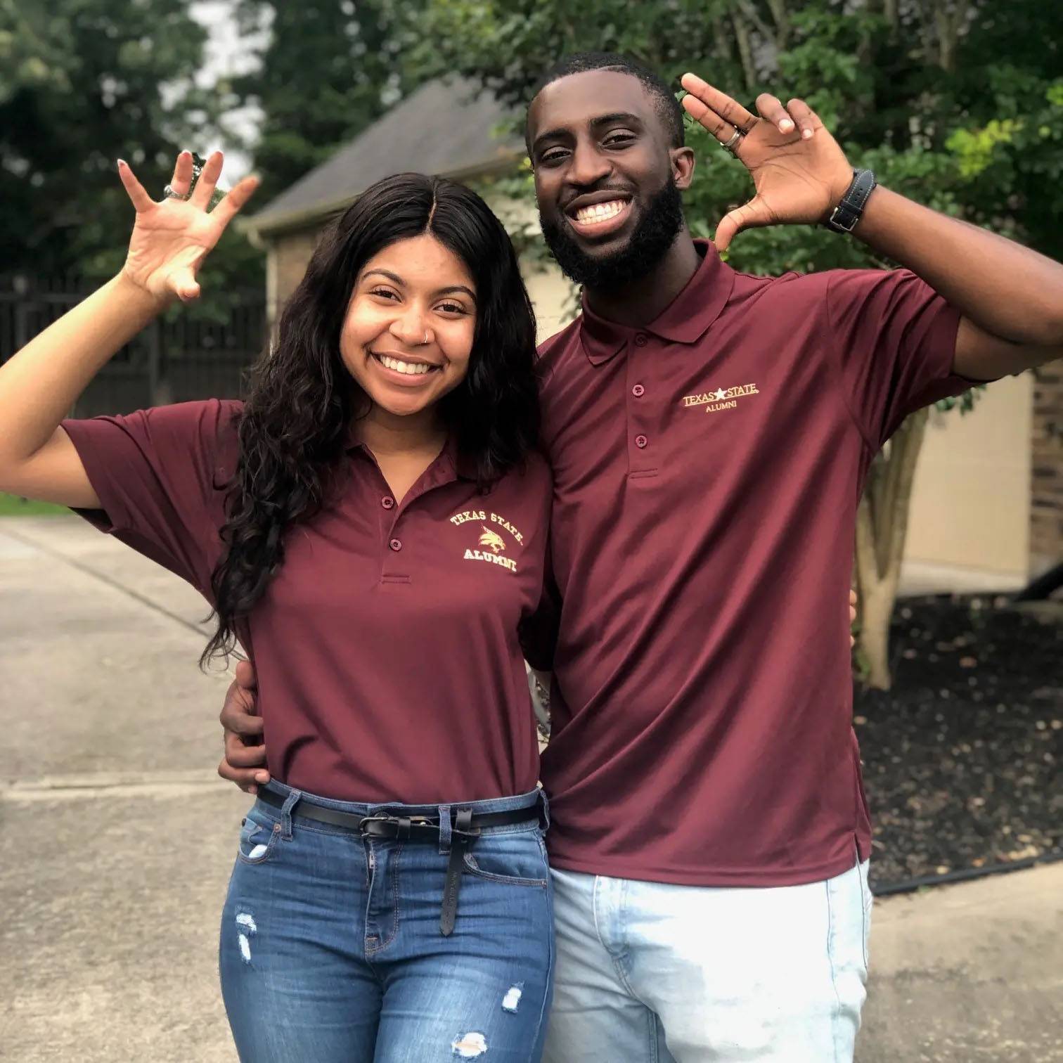 photo of couple wearing TXST Alumni tshirts