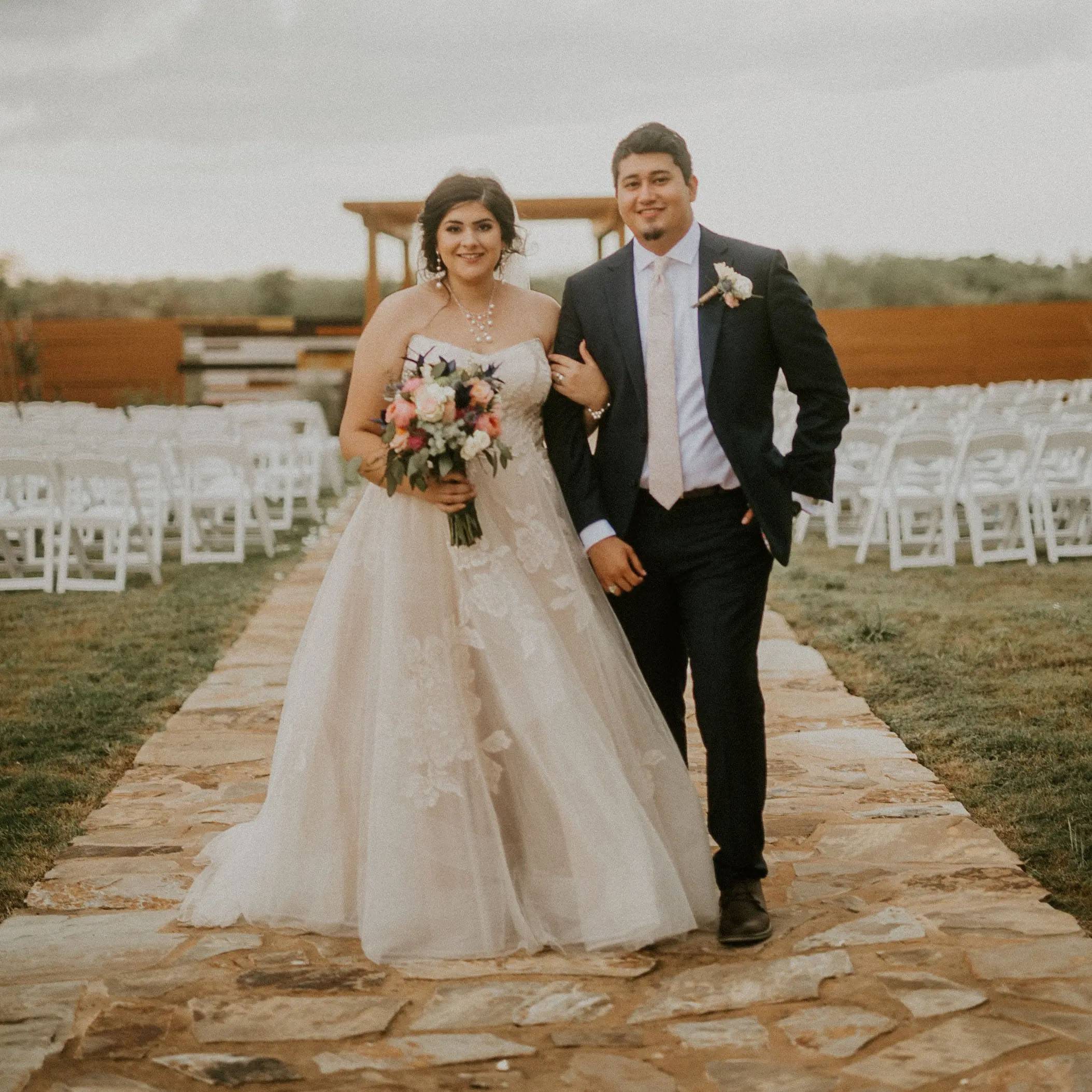 Photo of couple walking down the aisle at their wedding