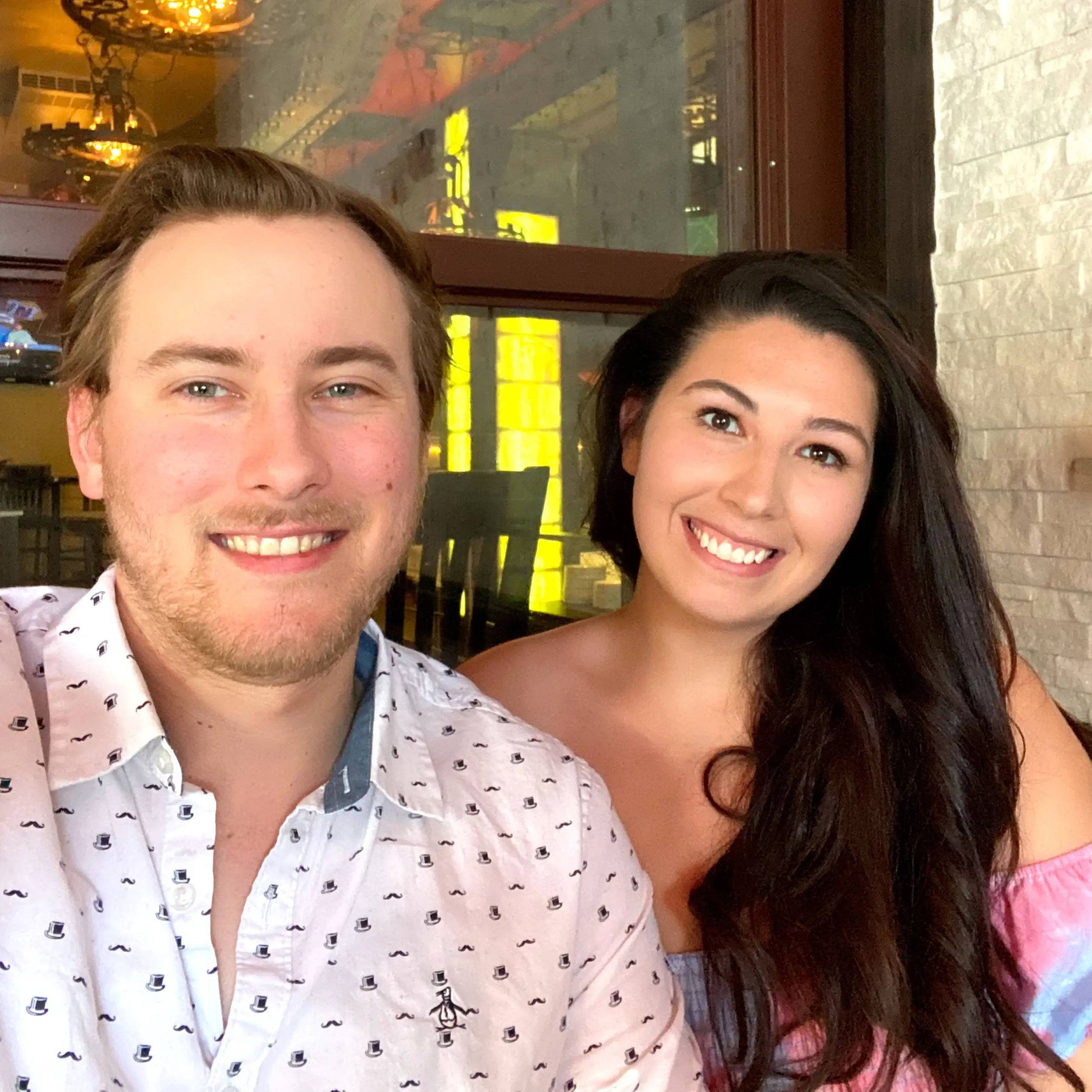 photo of couple smiling at a restaurant