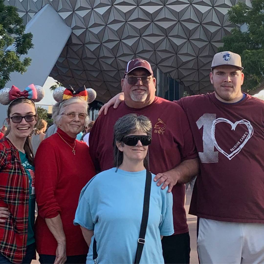 Photo of family at disneyworld